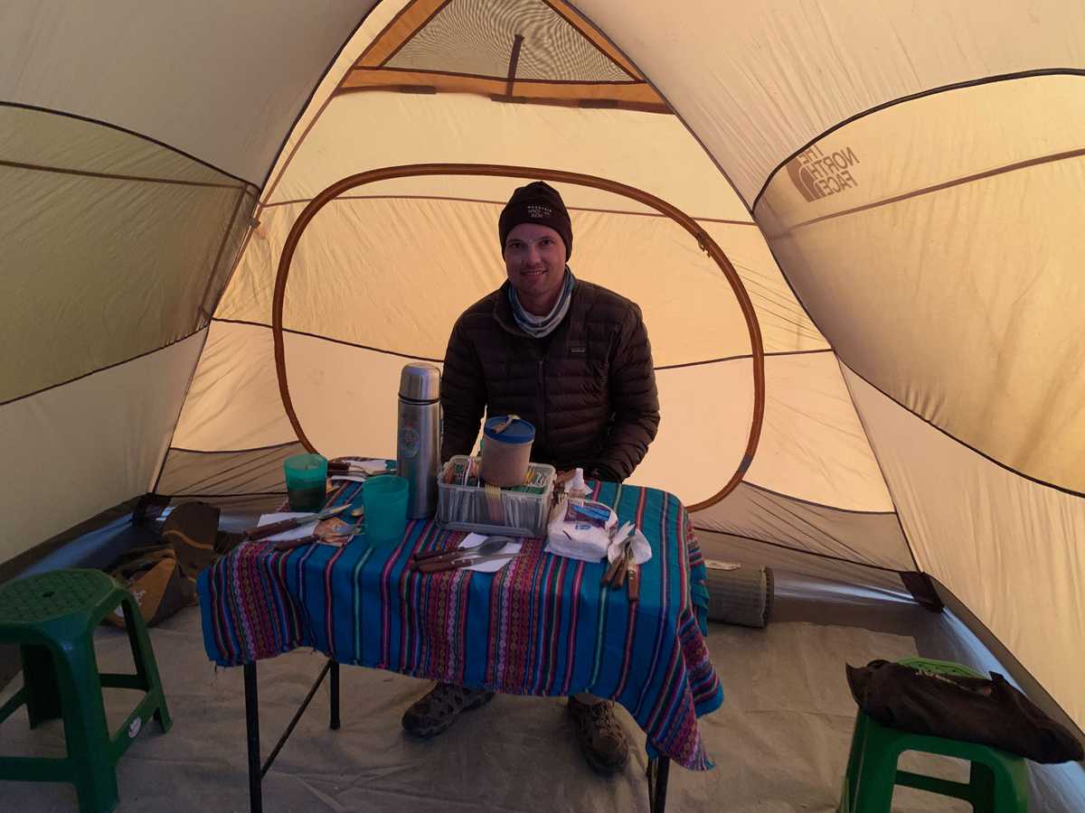 Eating dinner at basecamp, Illimani, Bolivia